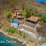 Aerial Photography of House along the Waters of Laguna de Apoyo